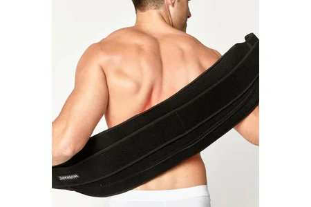 Man placing Nushape Therapy Wrap on his back